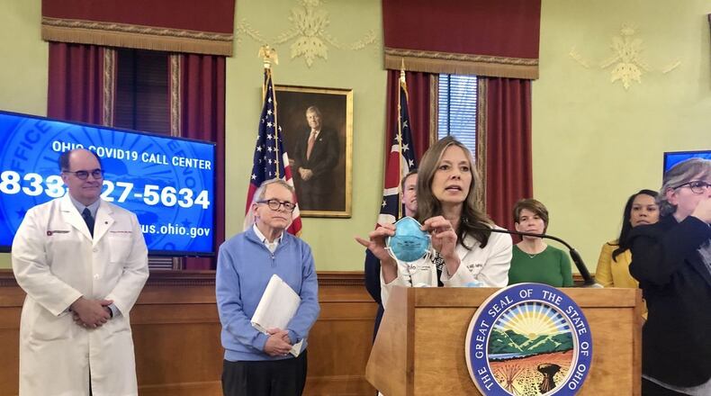 At a recent COVID-19 briefing, Ohio Department of Health Director Dr. Amy Acton holds up an N-95 mask which are in short supply. Area hospitals and emergency first responding agencies are developing agreements with Columbus-based Battelle to sanitize the masks and extend their longevity of use. LAURA HANCOCK/CLEVELAND.COM At Saturday afternoon COVID-19 briefing, Ohio Department of Health Director Dr. Amy Acton holds up a N-95 mask, which are in short supply. Laura Hancock / cleveland.com