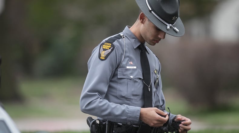 Ohio State Patrol trooper Sheldon Goodrum, along with other area troopers, are handling business during the coronavirus outbreak with some changes. JIM NOELKER/STAFF