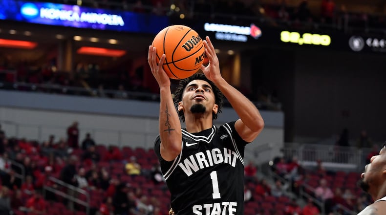 Wright State guard Trey Calvin (1) goes up for a layup during the first half of an NCAA college basketball game against Louisville in Louisville, Ky., Saturday, Nov. 12, 2022. Calvin scored 44 points in the Raiders' loss Thursday night at Youngstown State. (AP Photo/Timothy D. Easley)