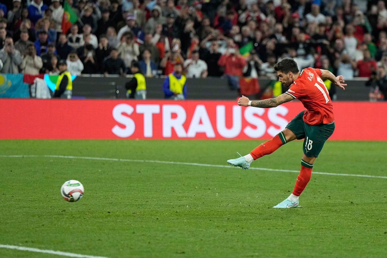 Portugal's Ruben Neves scores the penalty shootout during the Nations League final soccer match between Portugal and Spain at the Allianz Arena in Munich, Germany, Sunday, June 8, 2025. (AP Photo/Martin Meissner)