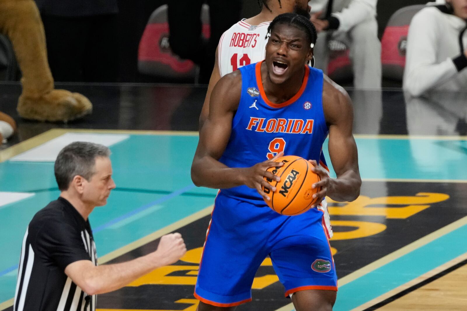 Florida's Rueben Chinyelu (9) reacts after being called for a foul against Houston during the second half in the national championship at the Final Four of the NCAA college basketball tournament, Monday, April 7, 2025, in San Antonio. (AP Photo/Stephanie Scarbrough)