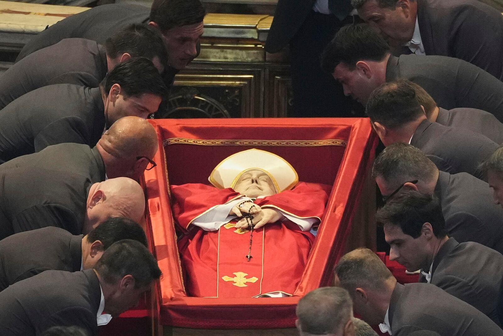 The body of Pope Francis is placed into St. Peter's Basilica at the Vatican, Wednesday, April 23, 2025, where he will lie in state for three days. (AP Photo/Andrew Medichini, Pool)