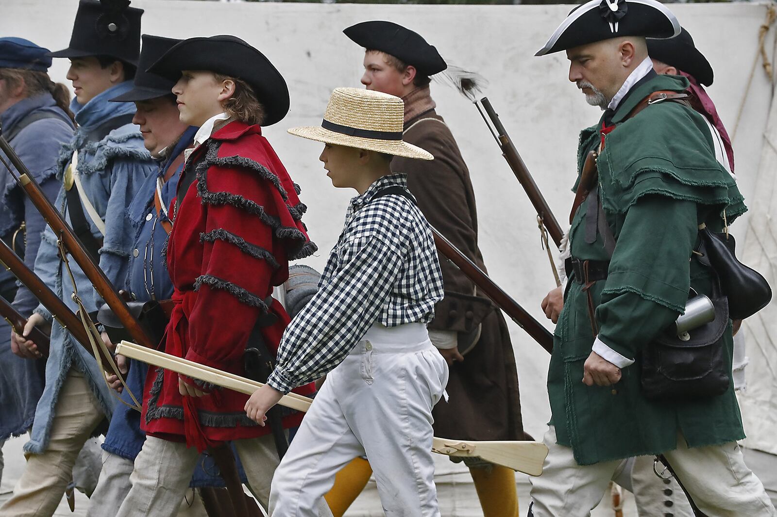 Men of all ages march in formation as they prepared for battle during last year’s Fair at New Boston. BILL LACKEY/STAFF