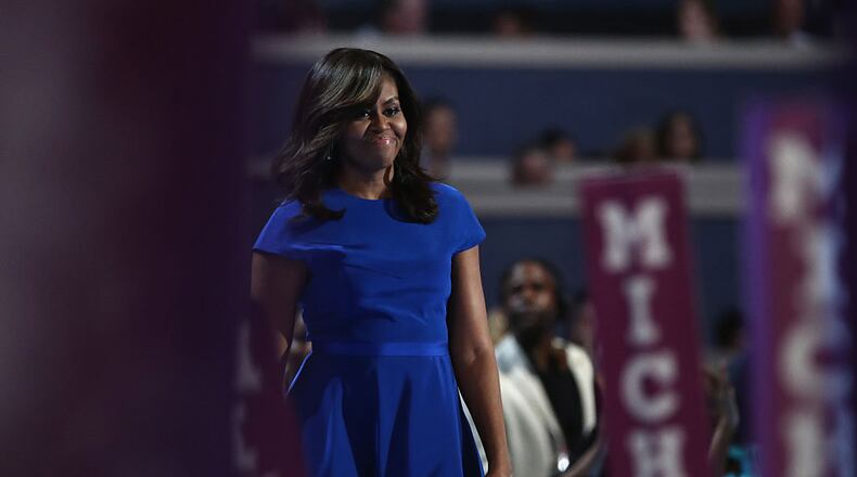 PHILADELPHIA, PA - JULY 25: First lady Michelle Obama walks on stage before delivering remarks on the first day of the Democratic National Convention at the Wells Fargo Center, July 25, 2016 in Philadelphia, Pennsylvania. An estimated 50,000 people are expected in Philadelphia, including hundreds of protesters and members of the media. The four-day Democratic National Convention kicked off July 25. (Photo by Jessica Kourkounis/Getty Images)