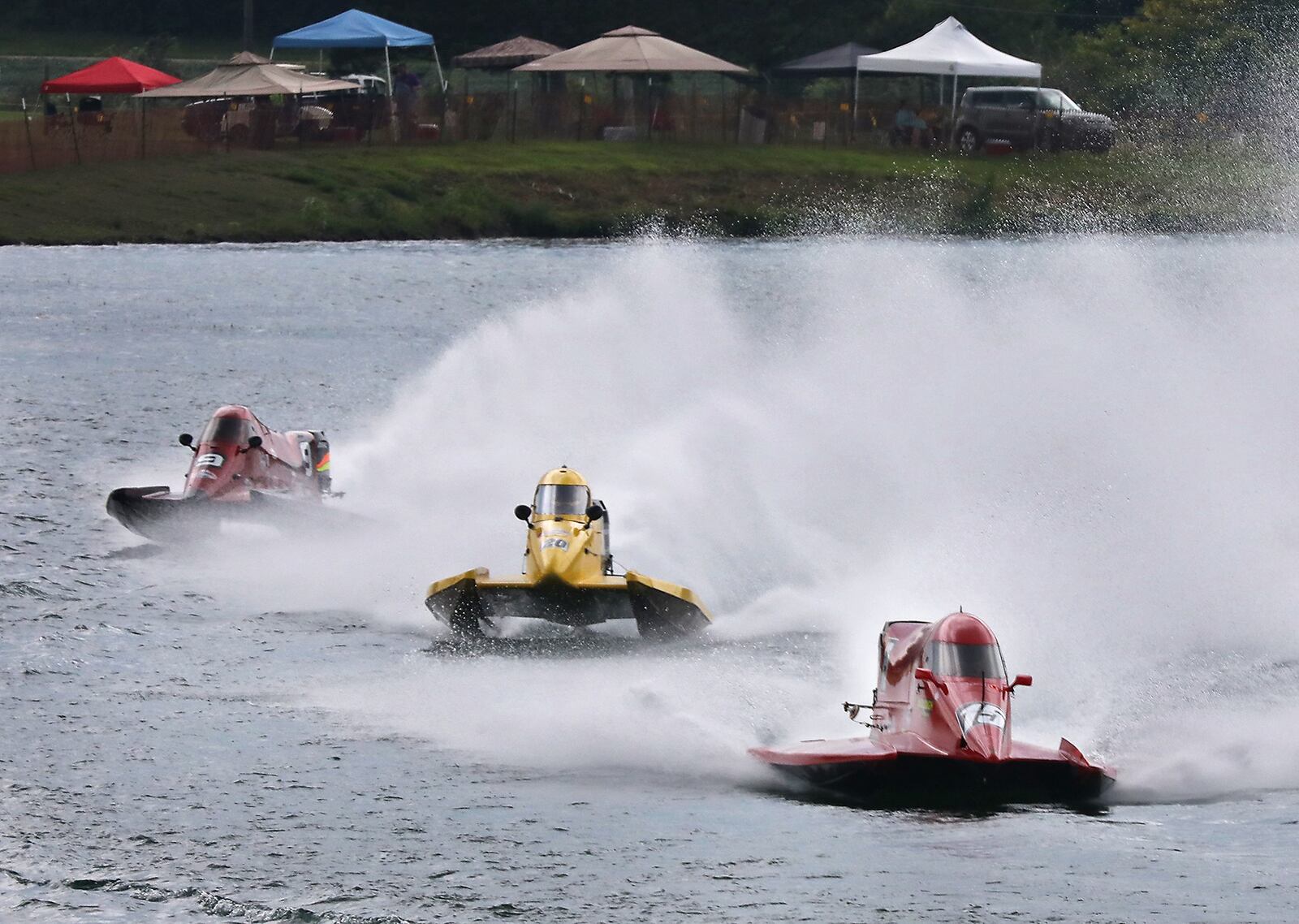 Drivers race around the Clark County Fairgrounds lake Friday as they practice for the Wake the Lake F1 Champaionships on Saturday and Sunday. BILL LACKEY/STAFF