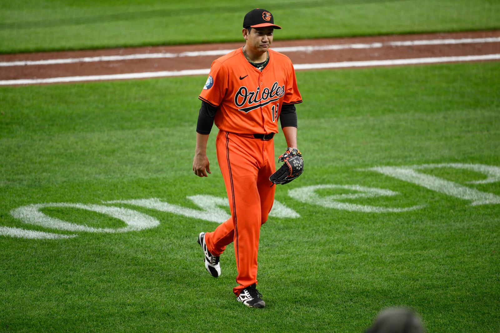 Baltimore Orioles starting pitcher Tomoyuki Sugano walks back to the dugout after he was pulled during the fifth inning of a baseball game against the Toronto Blue Jays, Saturday, April 12, 2025, in Baltimore. (AP Photo/Nick Wass)