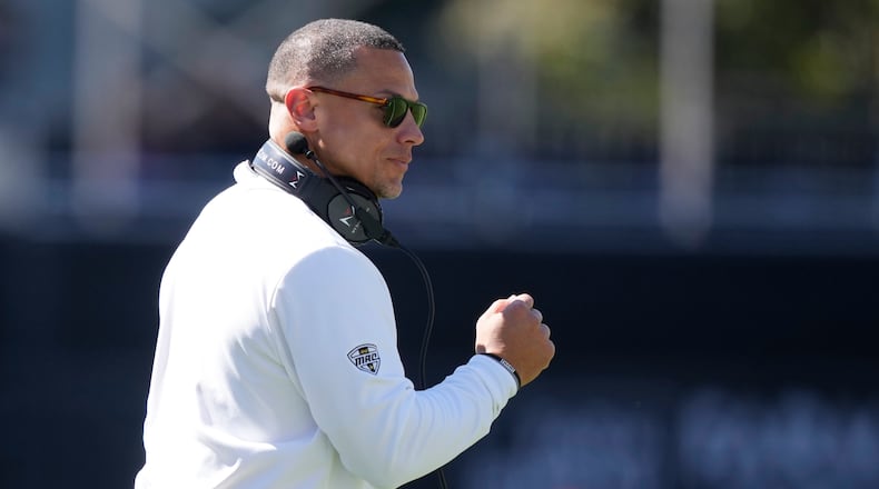 Western Michigan head coach Lance Taylor urges his team on during the second half of an NCAA college football game against Mississippi State, Saturday, Oct. 7, 2023, in Starkville, Miss. (AP Photo/Rogelio V. Solis)