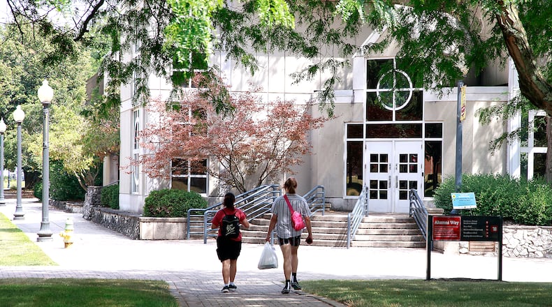 Two students walk across the campus of Wittenberg University Thursday, August 1, 2024. BILL LACKEY/STAFF