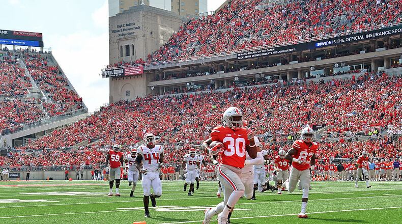 COLUMBUS, OH - OCTOBER 1: Demario McCall #30 of the Ohio State Buckeyes scores on a 20-yard touchdown run in the third quarter against the Rutgers Scarlet Knights at Ohio Stadium on October 1, 2016 in Columbus, Ohio. Ohio State defeated Rutgers 58-0. (Photo by Jamie Sabau/Getty Images)