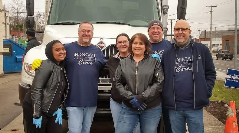 Nicole Adkins and With God’s Grace volunteers at one of the non-profit’s pantry events pre-COVID-19. CONTRIBUTED