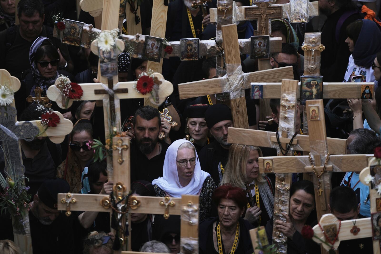 Christian pilgrims carry crosses during Good Friday procession in the Old City of Jerusalem on Friday, April 18, 2025. (AP Photo/Mahmoud Illean)
