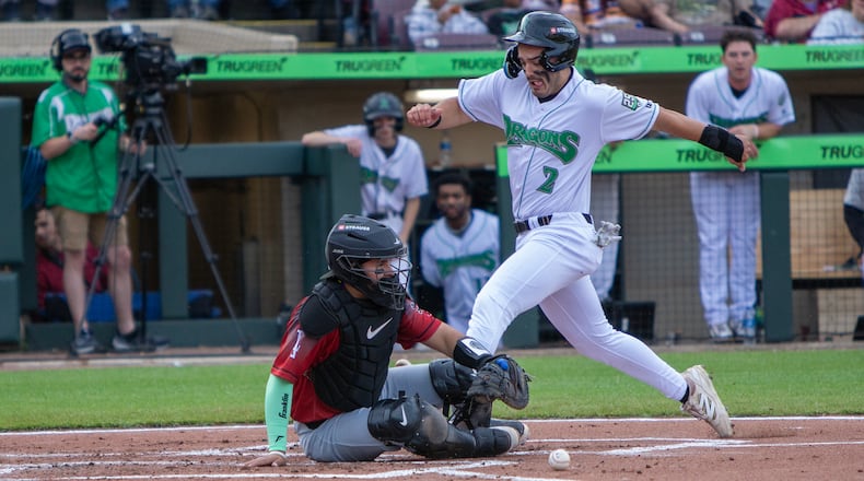 Anthony Stephan scores from first base on Johnny Ascanio's second-inning double for the Dragons' first run Wednesday night at Day Air Ballpark. Jeff Gilbert/CONTRIBUTED