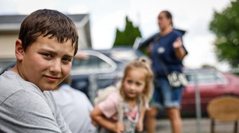 Howy Piatt, 9, was 4-years-old when the Memorial Day tornados damaged his Northridge neighborhood home. He now closely monitors the weather forecast on his phone. JIM NOELKER/STAFF
