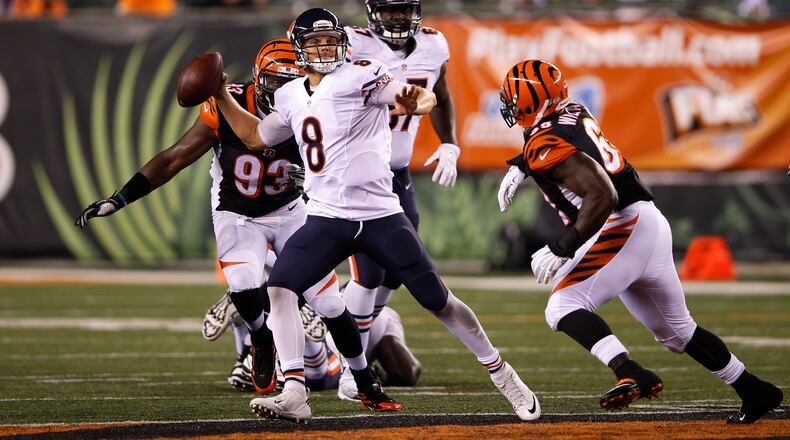 Jimmy Clausen #8 of the Chicago Bears looks to pass while under pressure from DeShawn Williams #69 of the Cincinnati Bengals in the third quarter of a preseason game at Paul Brown Stadium on August 29, 2015 in Cincinnati, Ohio. (Photo by Joe Robbins/Getty Images)