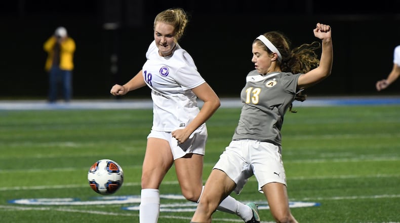 Bellbrook’s Jade Midtlien (left) and Alter’s Karaline Kernan vie for the ball during Tuesday’s Division II regional semifinal. Nick Falzerano/CONTRIBUTED