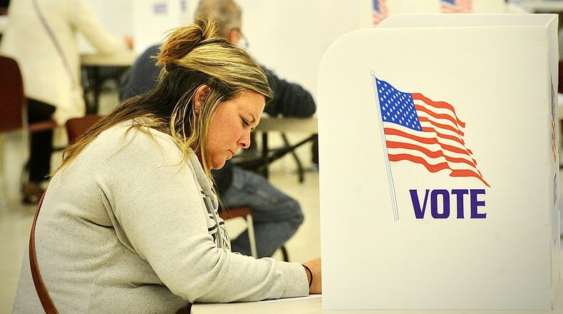 Andrea Heeley votes Tuesday, November 7, 2023 at the St. John the Baptist Catholic Church in Tipp City. MARSHALL GORBY \STAFF