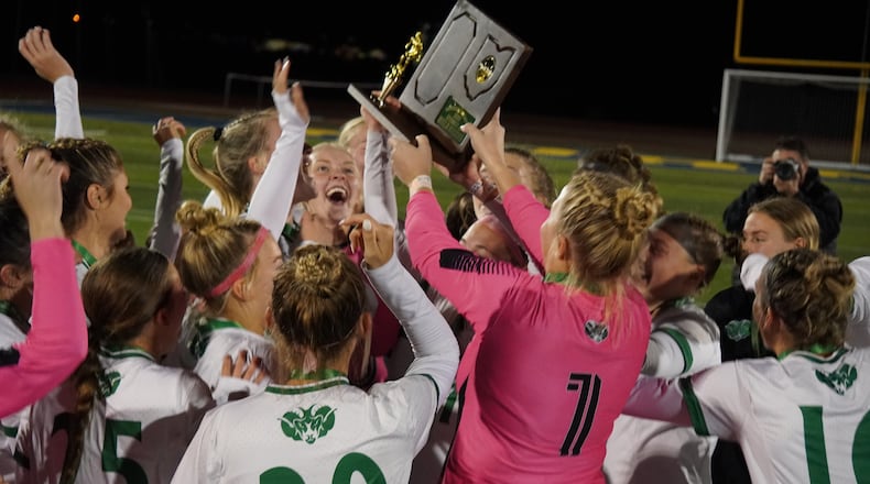 The Badin High School girls soccer team celebrates a Division III regional title following a 2-1 victory over Oakwood on Saturday at Monroe. CHRIS VOGT / CONTRIBUTED