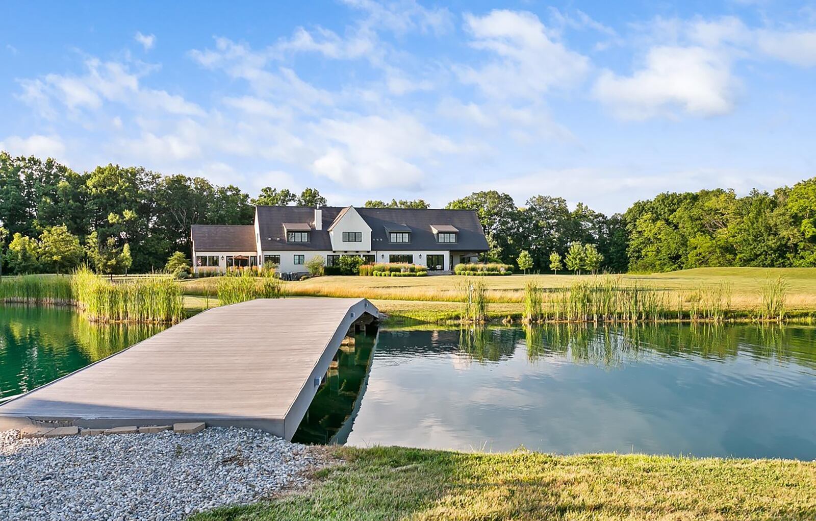 The rear of the home overlooks the property and the two ponds with fountains. CONTRIBUTED