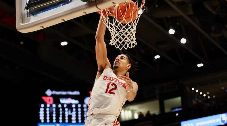 Dayton's Zimi Nwokeji dunks against Capital in an exhibition game on Saturday, Oct. 29, 2022, at UD Arena. David Jablonski/Staff