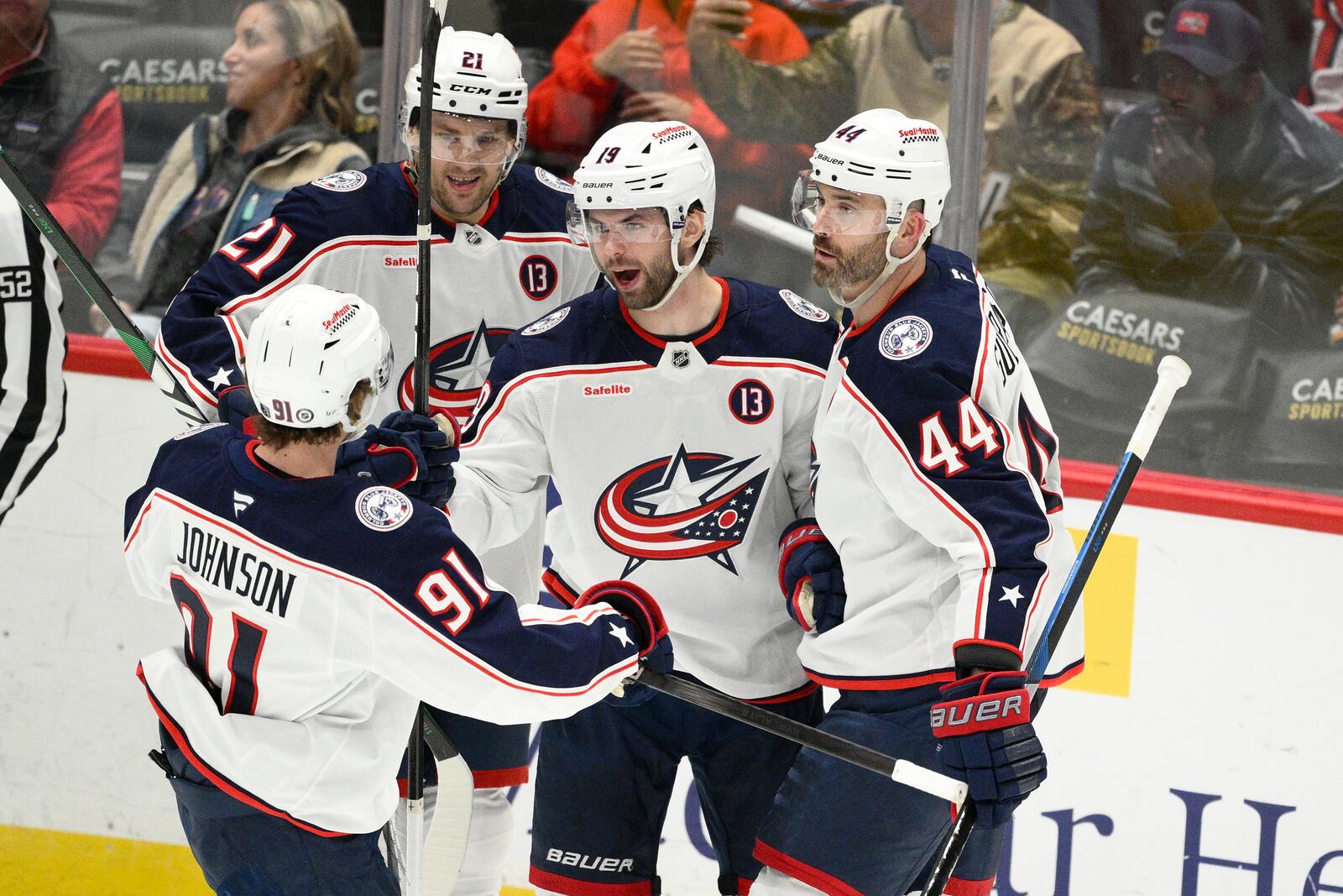 Columbus Blue Jackets center Adam Fantilli (19) celebrates his goal with teammates during the third period of an NHL hockey game against the Washington Capitals, Sunday, April 13, 2025, in Washington. (AP Photo/Nick Wass)