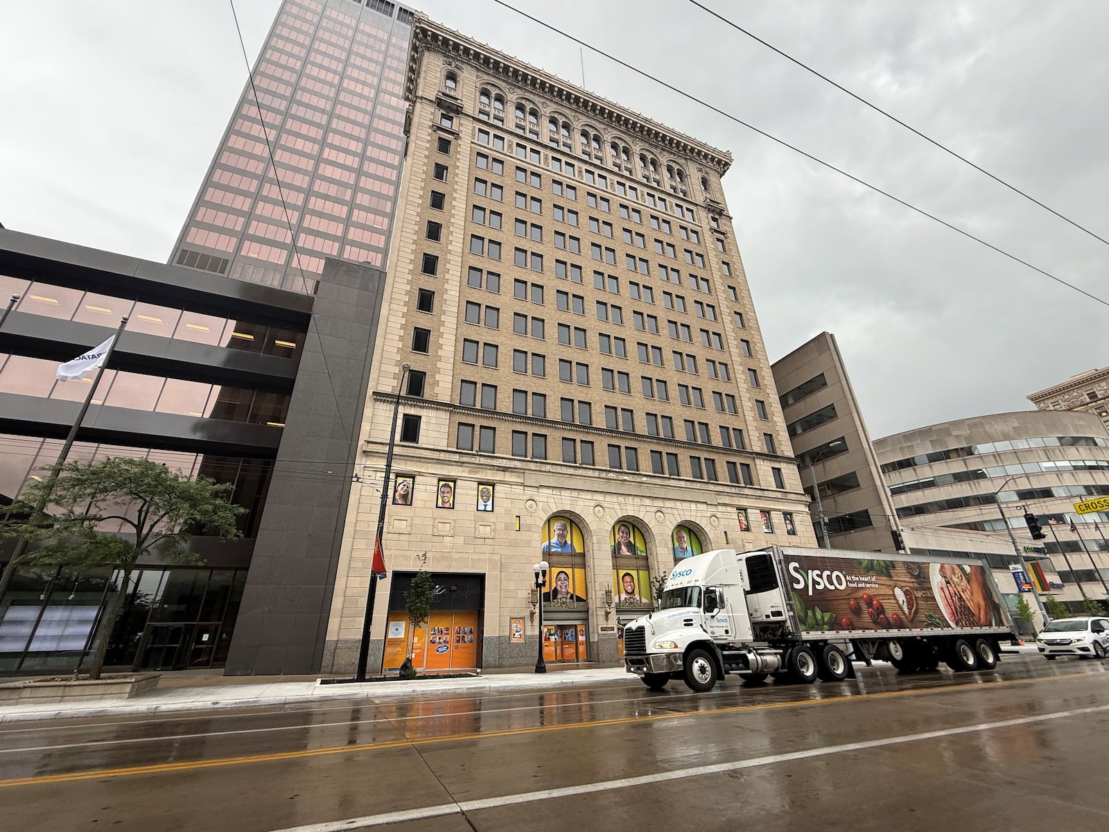 A tractor trailer drives by 34 N. Main St. in downtown Dayton. CORNELIUS FROLIK / STAFF