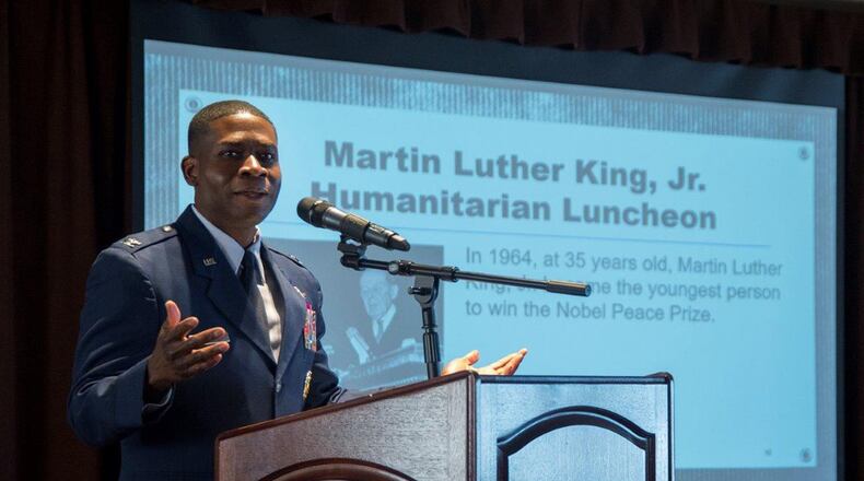 Col. Terrence Adams, Air Mobility Command director of communications and chief information officer, Scott AFB, Illinois, gives the keynote speech at the Dr. Martin Luther King Jr. Humanitarian Award Luncheon at Wright-Patterson Air Force Base Jan. 18. The luncheon recognized members of the Wright-Patt community who have made significant contributions to humanitarian causes locally and nationally. (U.S. Air Force photo/Richard Oriez)