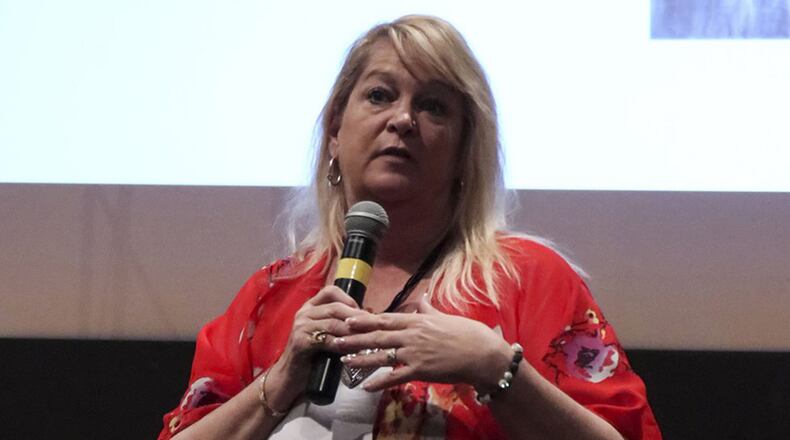 Theresa Flores, human trafficking survivor and author, shares her story with Airmen April 10 at Wright-Patterson Air Force Base. Flores was invited to speak as part of National Sexual Assault Awareness Month activities. (U.S. Air Force photo/Senior Airman Holly Ardern)