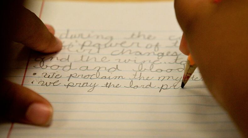 Cursive writing is not required in the state curriculum. FILE PHOTO