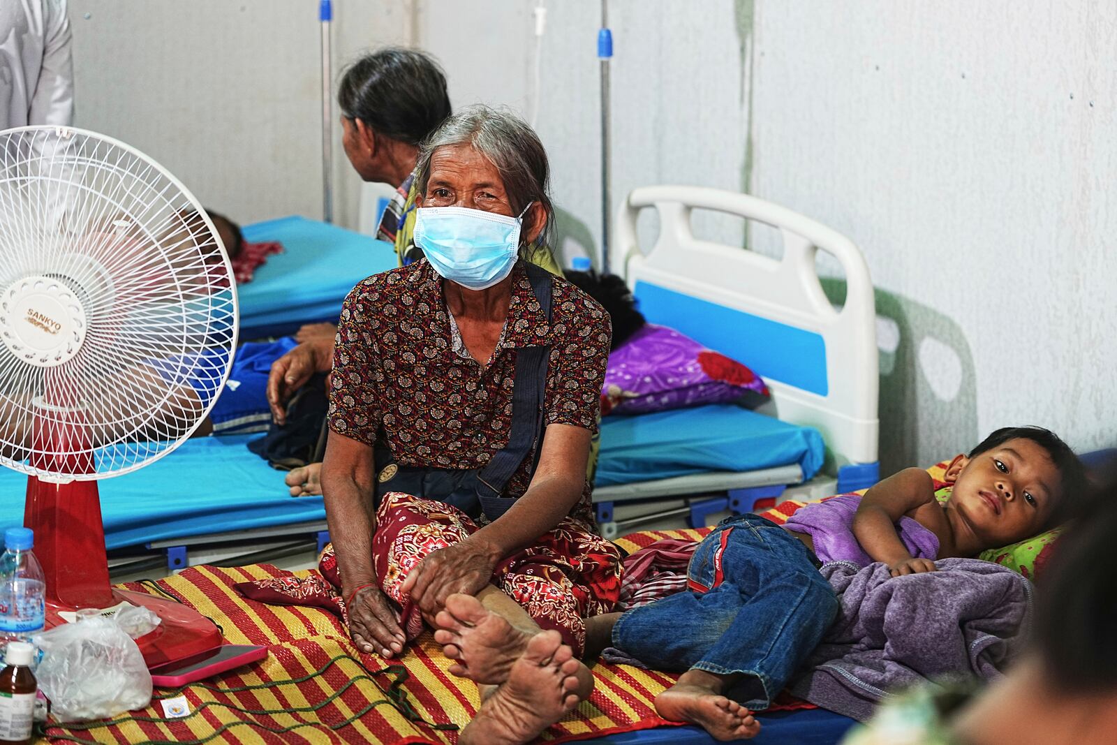 Cambodians villagers stay in a health center as they take refuge in Wat Phnom Kamboar In Oddar Meanchey province, Cambodia, Sunday, July 27, 2025, amid the fighting between Thailand and Cambodia. (AP Photo/Heng Sinith)