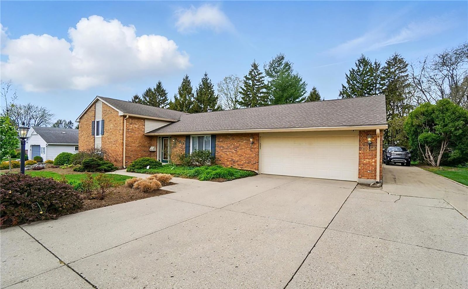 The brick tri-level has been completely remodeled and has two separate garages.