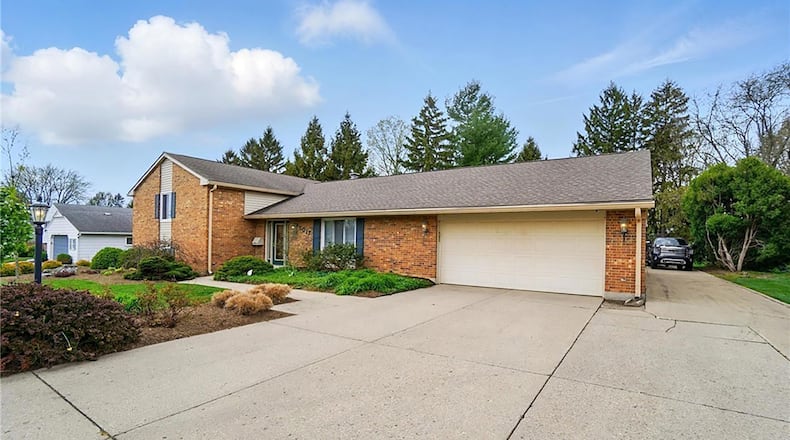 The brick tri-level has been completely remodeled and has two separate garages.