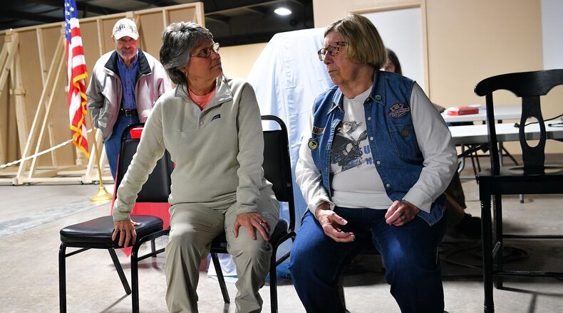 Terry Calvert (left) and Carmen "Penny" Adams talk before a program at the Miami Valley Veterans Museum. The women are among area residents included in a new exhibit on women in the military that opened March 18. Contributed