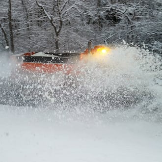 A plow clears Elk Creek Road after several inches of snow fell Tuesday, Dec. 2, 2025 in Madison Township in Butler County. NICK GRAHAM/STAFF