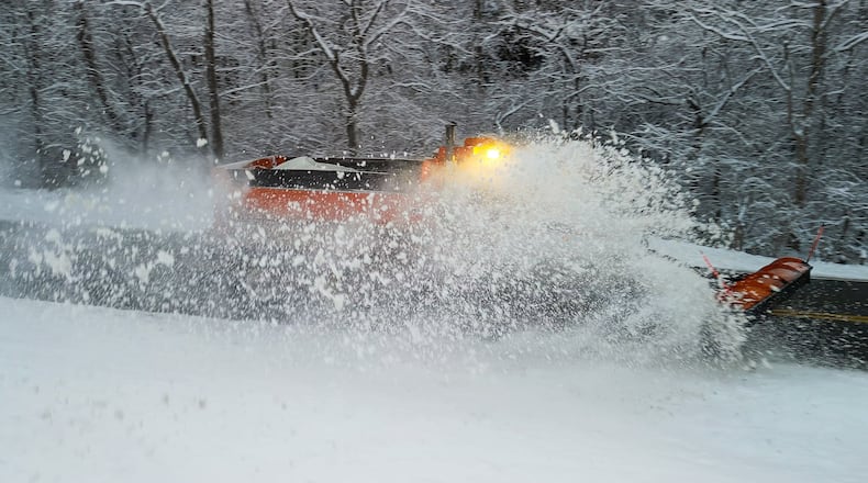 A plow clears Elk Creek Road after sveral inches of snow fell Tuesday, Dec. 2, 2025 in Madison Township in Butler County. NICK GRAHAM/STAFF