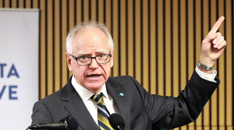 Minnesota Gov. Tim Walz responds to questions from reporters regarding whether he will seek a third term during a press conference following an event on the state's new Paid Family and Medical Leave program, Tuesday, Jan. 6, 2026, in Minneapolis. (Kerem Yücel/Minnesota Public Radio via AP)