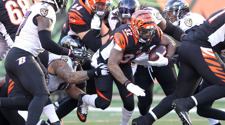 CINCINNATI, OH - JANUARY 3: Jeremy Hill #32 of the Cincinnati Bengals carries the ball during the fourth quarter of the game against the Baltimore Ravens at Paul Brown Stadium on January 3, 2016 in Cincinnati, Ohio. Cincinnati defeated Baltimore 24-16. (Photo by John Grieshop/Getty Images)