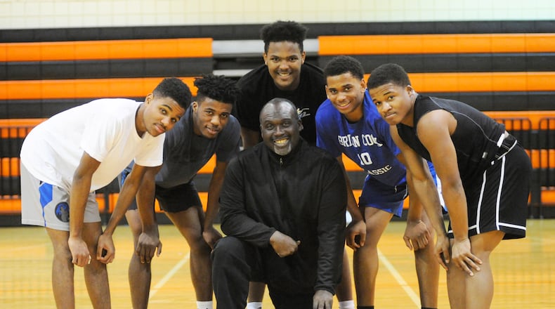 The Stivers High School boys basketball team has rallied around coach Felix Turner (Center). Taking a break from practice are Tigers starters Allen Lattimore (left), Da’juan Allen, Lorenzo Lewis, Trevon Ellis and Doug Spear on Wednesday, Jan. 2, 2019. MARC PENDLETON / STAFF