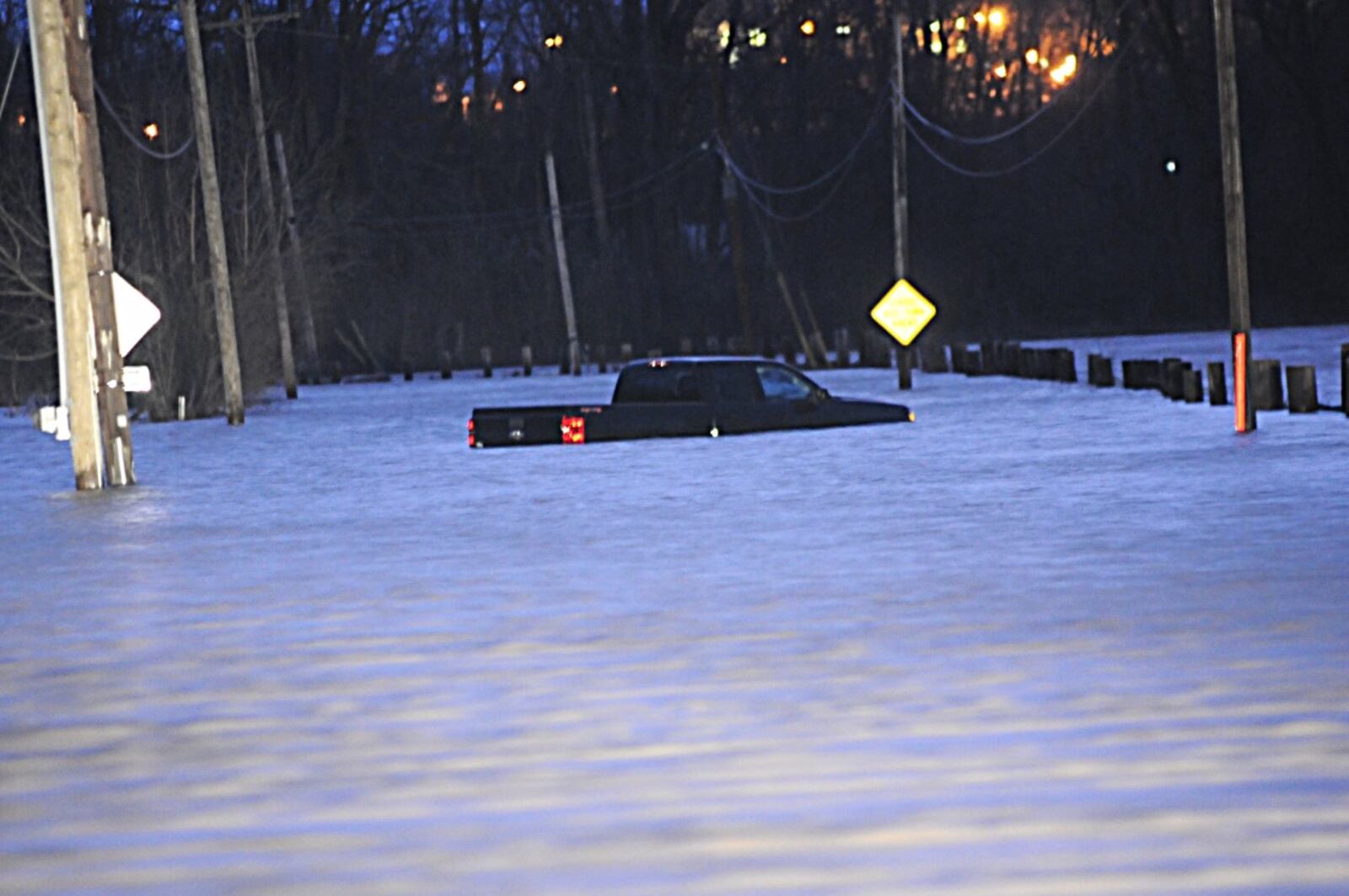 Two people had to be rescued after this truck became trapped in high water on Lower Valley Pike Wednesday morning.