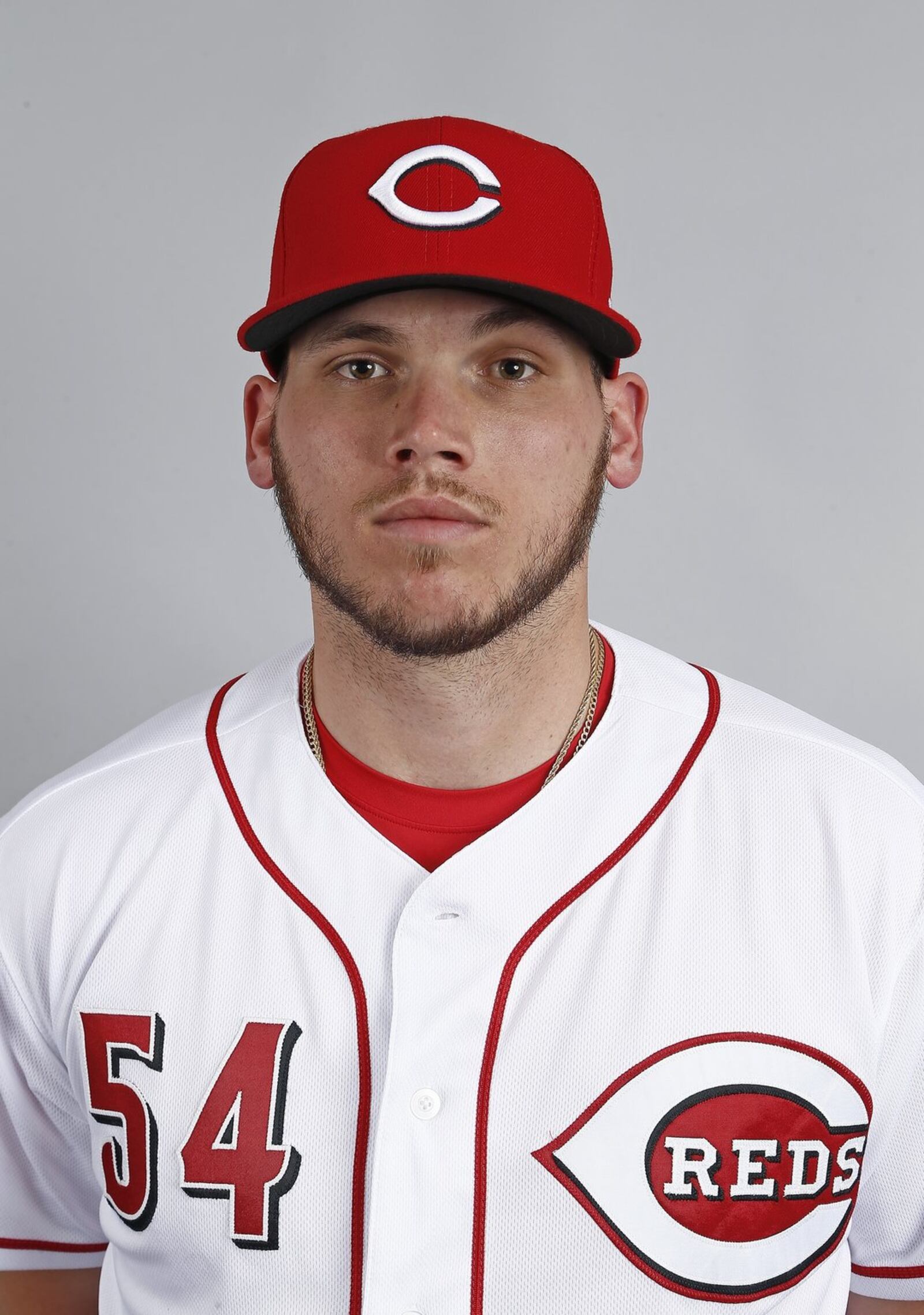 Pitcher Rookie Davis, competing for a rotation spot, will be on the mound for the Reds when they open Cactus League play Friday against the Giants in Goodyear, Arizona. (AP Photo/Ross D. Franklin)