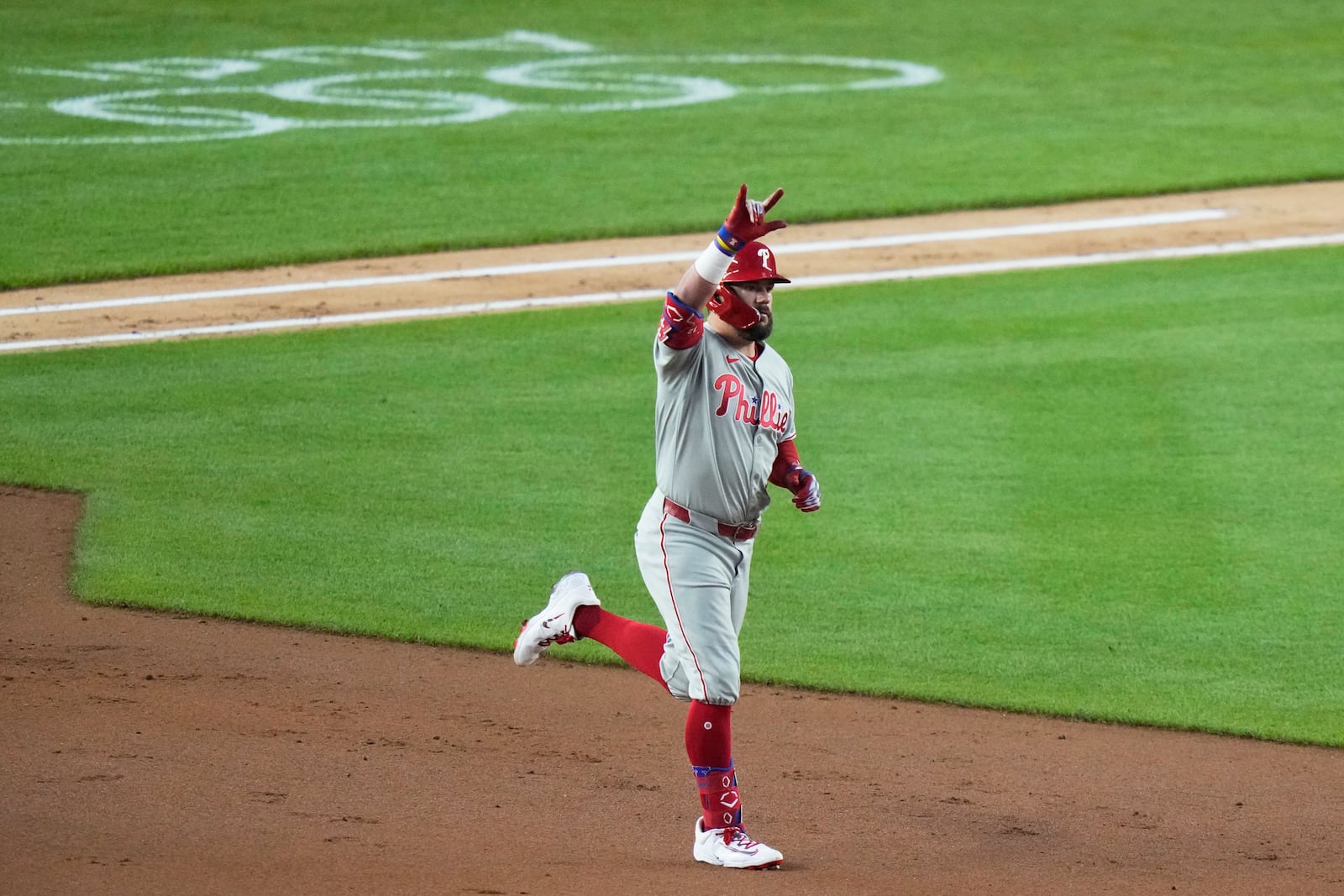 Philadelphia Phillies' Kyle Schwarber gestures as he runs the bases after hitting a two-run home run during the fifth inning of a baseball game against the New York Yankees Friday, July 25, 2025, in New York. (AP Photo/Frank Franklin II)
