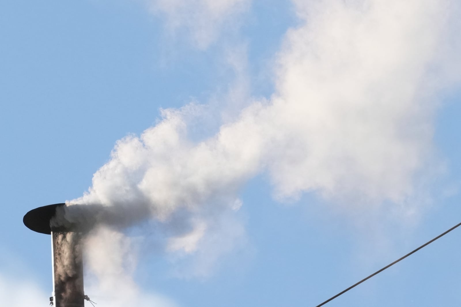 White smoke billows from the chimney of the Sistine Chapel during the conclave to elect a new pope, at the Vatican, Thursday, May 8, 2025. (AP Photo/Andrew Medichini)