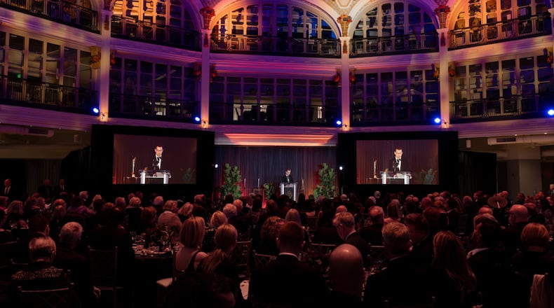 Executive Director Nicholas Raines gives opening remarks and Salman Rushdie gives his acceptance speech at the Nov. 9, 2025 Dayton Literary Peace Prize awards gala held in the rotunda of the Dayton Arcade. Chris Snyder / CONTRIBUTED