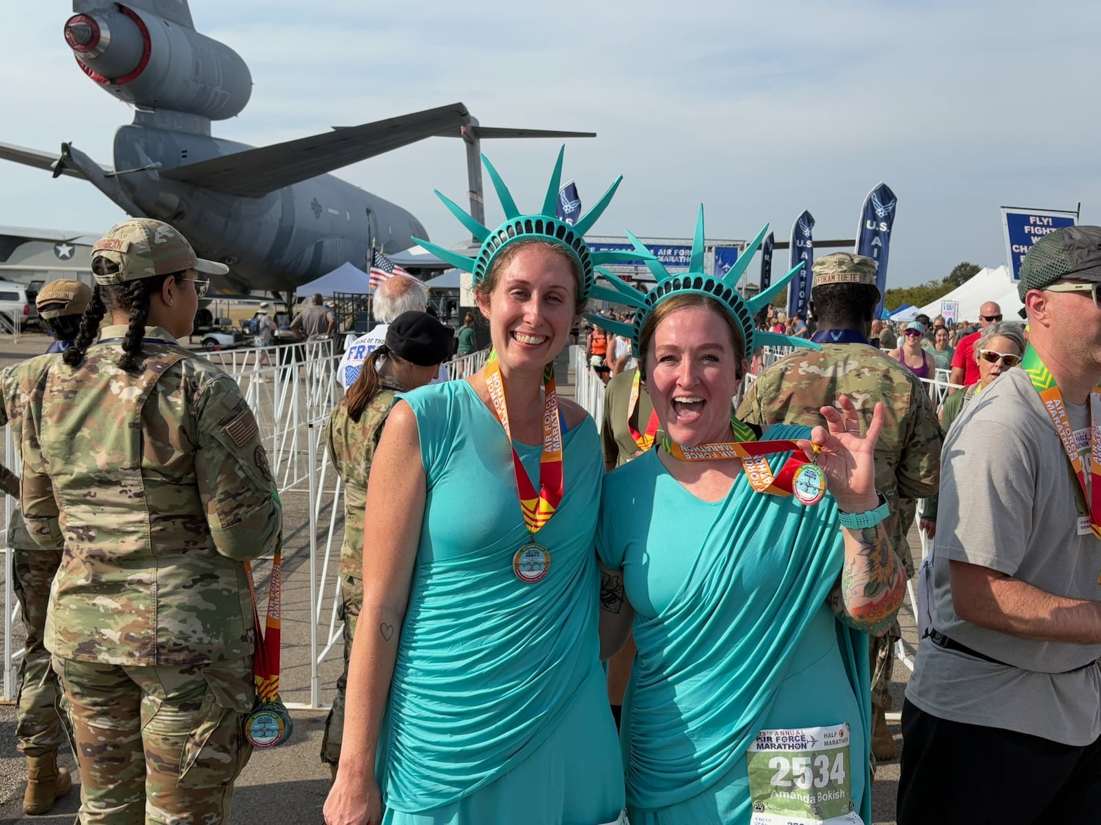 Friends Caitlin Schultze (on left) and Amanda Bokish dress up in different costumes each year for the Air Force Marathon. This year they ran as Lady Liberty. TOM ARCHDEACON / CONTRIBUTED PHOTO