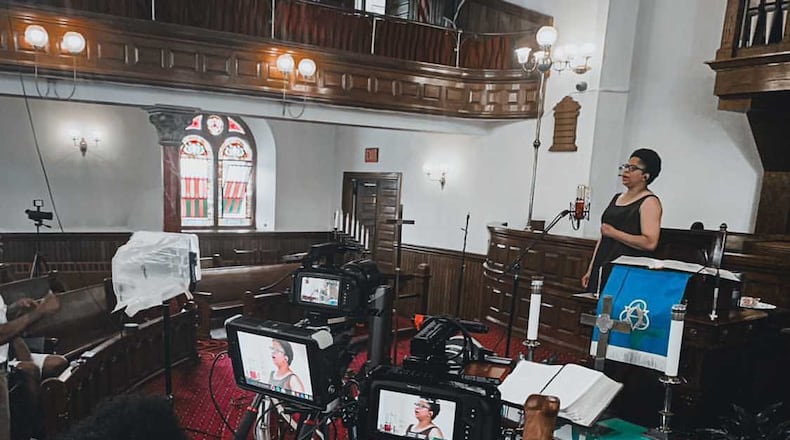 Terrance Auster, a student at The Modern College of Design in Kettering, is shown here working behind the camera at a Philadelphia church for Nu Millennium Studios in 2020. This semester he is working for the University of Dayton Athletic Department as part of the college’s new co-op program. CONTRIBUTED.
