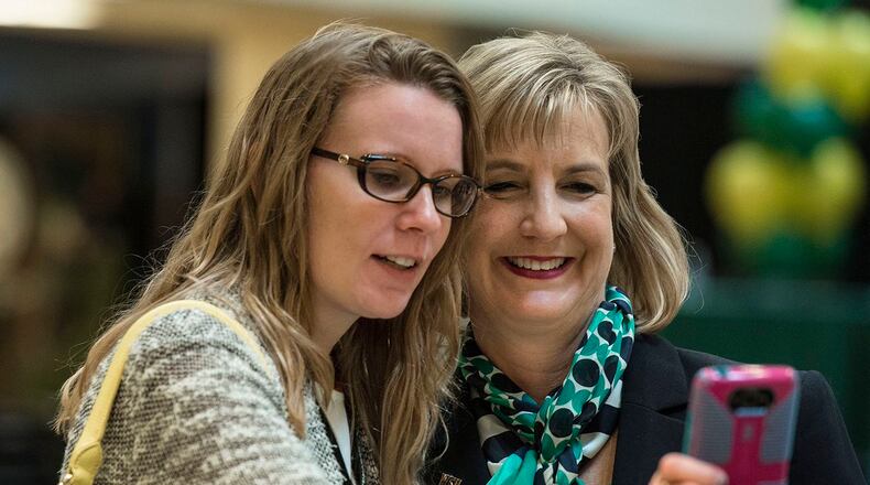 Cheryl Schrader poses for a photo with a student at Wright State University. Schrader took office on Saturday.