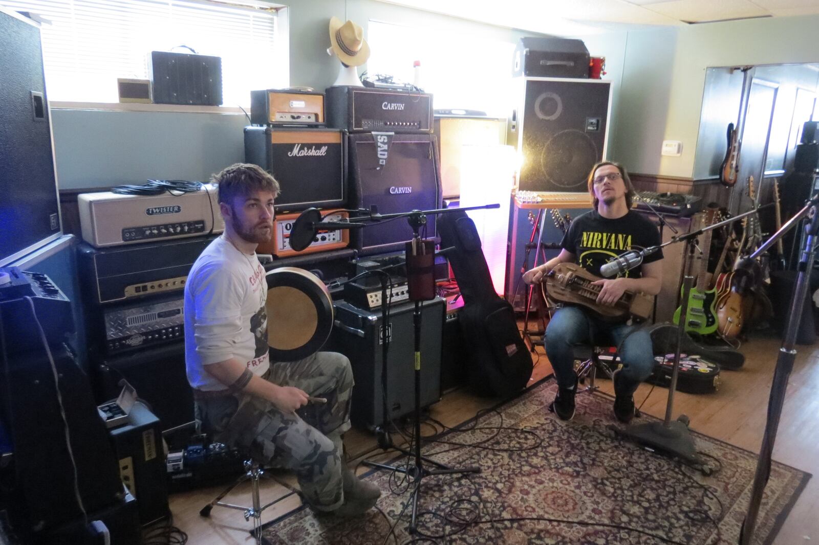 Slavalachia members Brett Hill (left) and Siarzhuk Douhushau, recording a new compilation album at Reel Love Recording Company, will perform at a Benefit for Ukraine at Sueño in Dayton on Sunday, April 24.