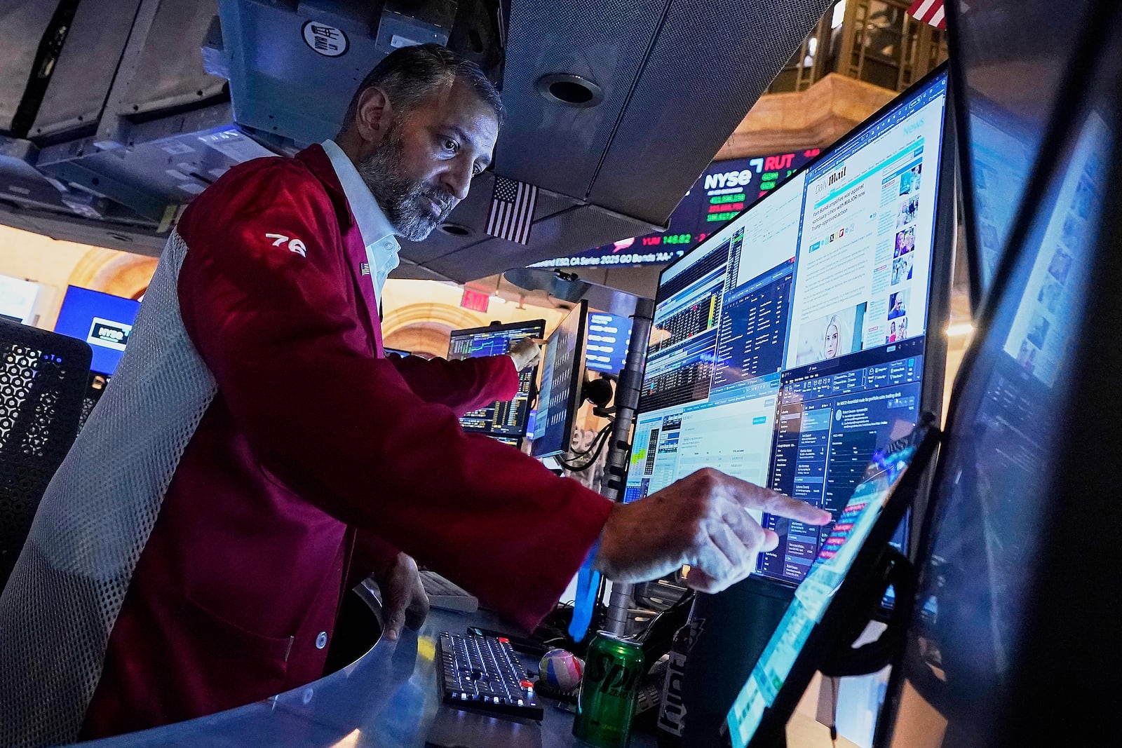 Trader Aman Patel works on the floor of the New York Stock Exchange, Monday, May 5, 2025. (AP Photo/Richard Drew)