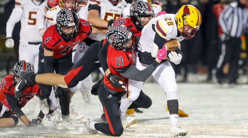 Cutline: New Bremen High School running back Hunter Schaefer runs the ball during their game against Fort Loramie on Saturday night at Sidney Memorial Stadium. The Cardinals won 24-0 to claim their second Division VII, Region 28 championship in three years. CONTRIBUTED PHOTO BY MICHAEL COOPER