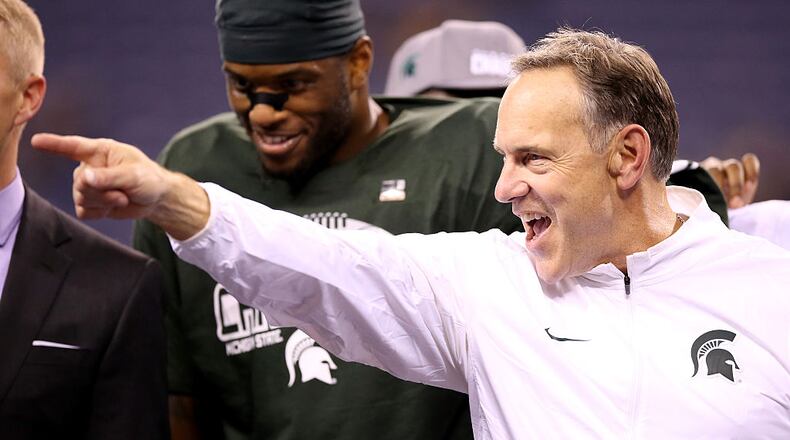 INDIANAPOLIS, IN - DECEMBER 05: Head coach Mark Dantonio of the Michigan State Spartans celebrates after beating the Iowa Hawkeyes in the Big Ten Championship at Lucas Oil Stadium on December 5, 2015 in Indianapolis, Indiana. (Photo by Andy Lyons/Getty Images)