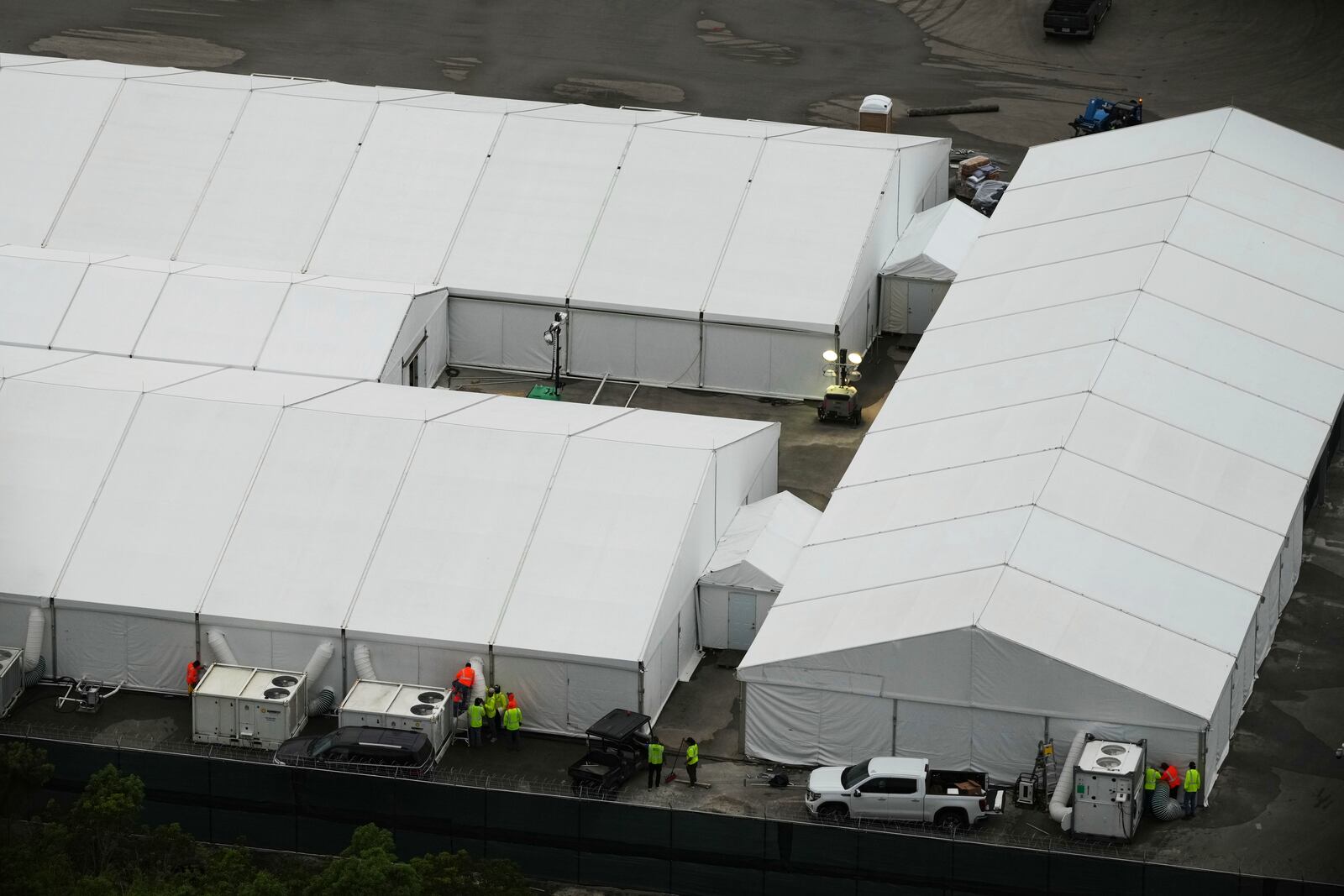 Work progresses on a new migrant detention facility dubbed "Alligator Alcatraz," at Dade-Collier Training and Transition facility in the Florida Everglades, Friday, July 4, 2025, in Ochopee, Fla. (AP Photo/Rebecca Blackwell)